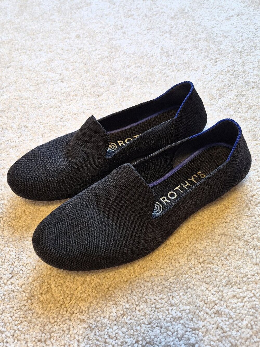 Rothy's Black Slip-On Flats with Blue Trim